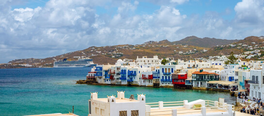 Large cruise ships anchored in the new port of Mykonos, Cyclades Islands, Aegean Sea, Greece. The...