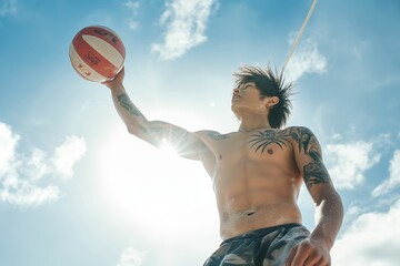 A man is playing with a volleyball in the sun