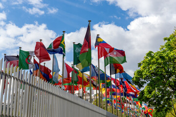 Flags fluttering in the wind in front of the UNESCO (United Nations Educational, Scientific and...