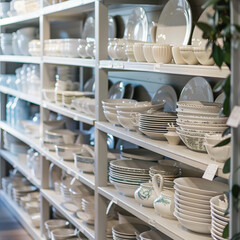 Discover Shelves of Ceramic Dishes in a Home Goods Store: Elegant Table Settings