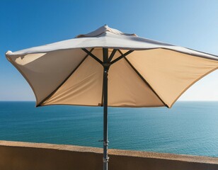 Minimal summer holidays vacation concept. Beach umbrella in front of blue sky and sea. Chilling, lounging on the beach