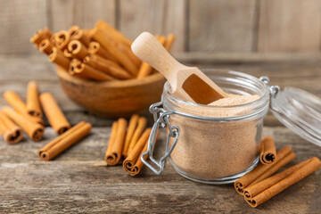 Cinnamon sugar on a texture background. Homemade cinnamon sugar in a bowl on background. Brown sugar. Spice mixture for drinks and baking. Place for text. Copy space.