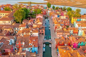 Positive colorful rainbow island of Burano. City on water Venice. Drone type. Places worth visiting.