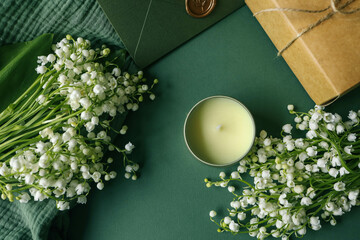 Aroma candle in a cozy home spring interior - obrazy, fototapety, plakaty