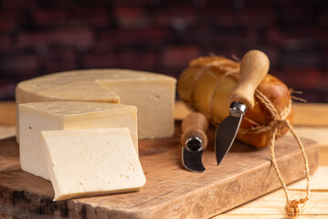 Cheese, details of beautiful and delicious cheese on rustic wooden surface, selective focus.