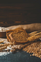 Sliced rye bread on cutting board. Whole grain rye bread with seeds
