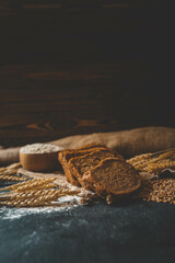 Sliced rye bread on cutting board. Whole grain rye bread with seeds