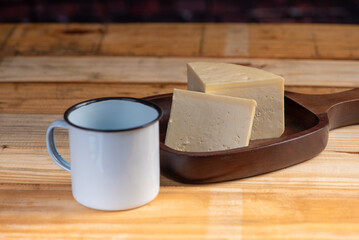 Cheese, details of beautiful and delicious cheese on rustic wooden surface, selective focus.