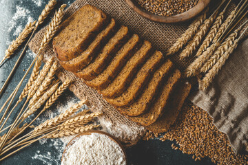 Sliced rye bread on cutting board. Whole grain rye bread with seeds