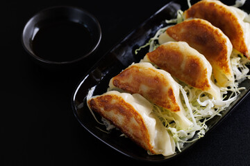 Gyoza Japanese food dumpling isolated in black background