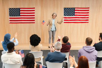 Smiling confident woman, politician, presidential candidate holding American flag communication