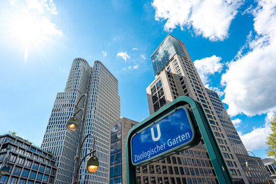 Berlin, Germany - April 27, 2024: View to the skyscrapers in the western downtown of Berlin with the sign of the undergroundstation Zoologischer Garten in the foreground.