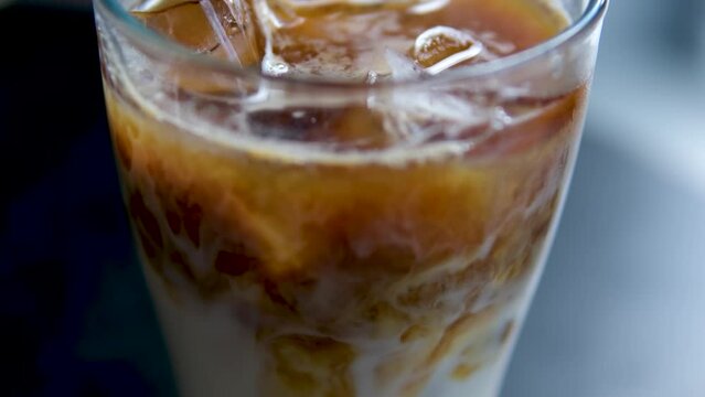 iced late in transparent glass on cafe table 