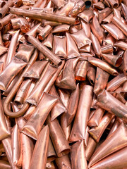 Copper tubes chopped and ready to be recycled, portrait view