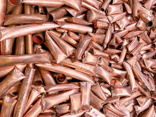Copper tubes chopped up at a recycling plant, ready for re-melting.