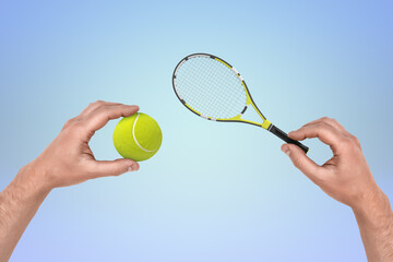 Hands holding a tennis racket and ball