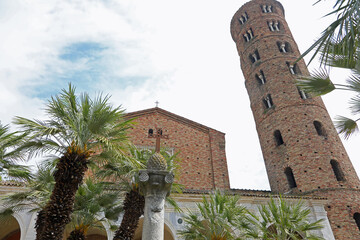 Saint Apollinare Nuovo and bell tower and the sculpture of a pine cone