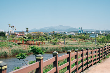 Volcanic Oreum and country village trail road in Jeju island, Korea