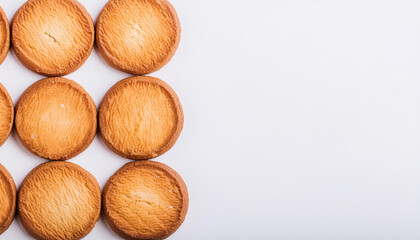 Freshly baked round cookies on white table. Tasty food. Delicious snack. Homemade bakery. Top view