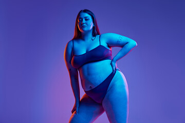Portrayal of body positivity. Beautiful young girl with plus size body shape, posing underwear...