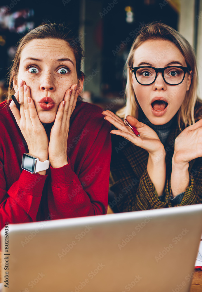 Aufkleber half length portrait of excited hipster students shocked with big sales on website.emotionally amaze