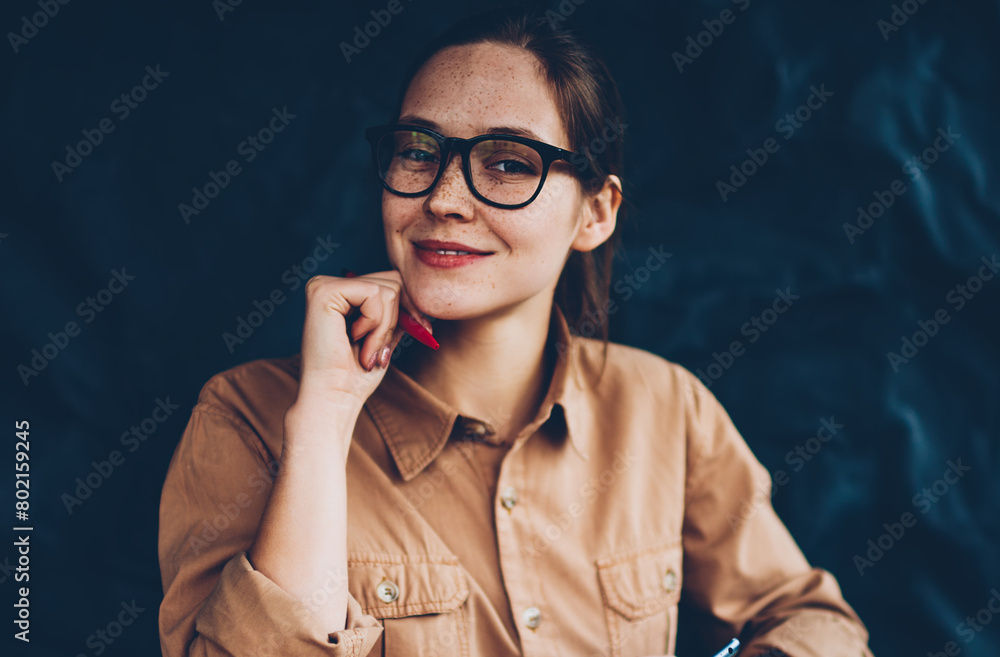 Aufkleber half length portrait of happy female graphic designer in eyeglasses smiling at camera while holding 