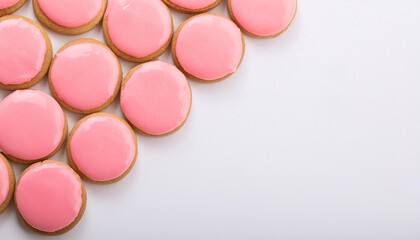 Freshly baked cookies with pink glaze on white table. Tasty food. Delicious snack. Baked goods