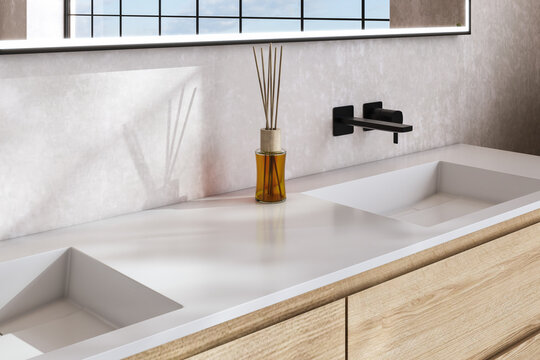 A bathroom sink with a vase of flowers on top of it