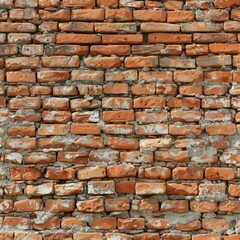 A brick wall with red bricks and gray mortar.
