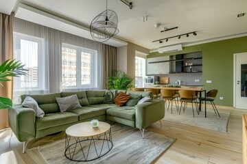 Modern Urban Apartment Living Room with Stylish Green Sofa and Open Kitchen