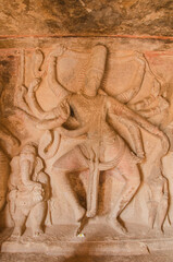 Fototapeta premium Sculpture or carving of dancing Shiva and Ganesha, Ravana padi Cave Temple Complex, Aihole, Badami, Karnataka, India.