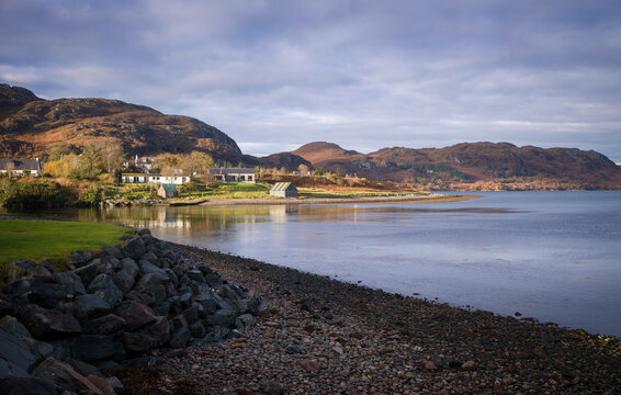 Houses of Poolewe on the waters edge of Loch Ewe in the Scottish Highlands in Scotland, UK.