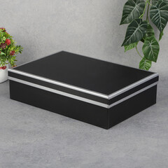 Black box, mockup, empty box on grey background table, clean black container photo