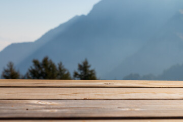 Wooden table terrace with fresh morning atmosphere mountain landscape