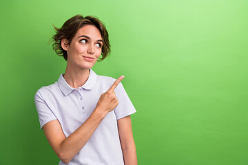 Photo of young girl investment manager point finger copyspace click website page check potential income isolated on green color background