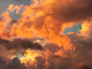 Gathering clouds with signs of an approaching storm during golden hour early in June in southwest...