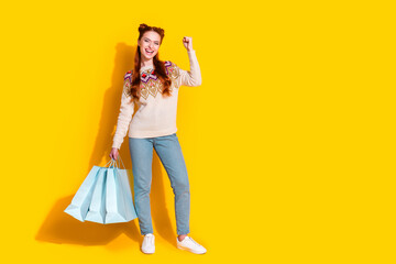 Photo portrait of attractive woman shopping bags winning dressed stylish knitted warm outfit...