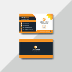 Double-sided creative and modern business card template with navy blue and orange colour.
Landscape orientation. Vector illustration 