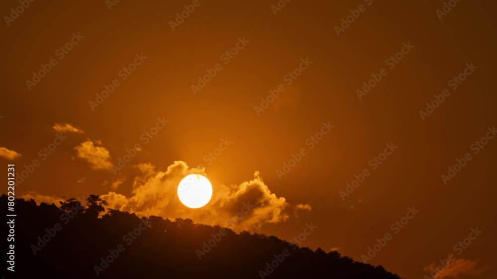 Wall mural timelapse of dramatic sunrise with orange sky in a sunny day.