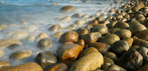 Close-up of pebble beach. Long exposure shots.