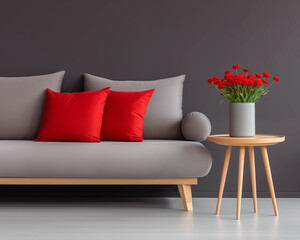 Elegant living room interior with grey sofa red pillows and flowers in vase on wooden table