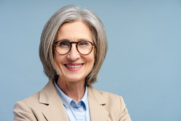 Fototapeta premium Smiling senior business woman, manager wearing eyeglasses looking at camera isolated