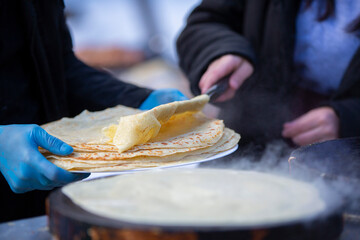 Street food. Fried pancakes in a street cafe.