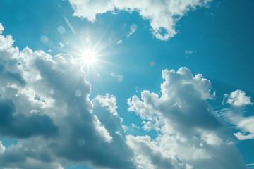 Bright sun illuminating fluffy clouds in a clear blue sky during midday