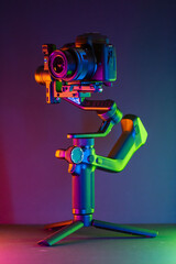 Close up on a modern gimbal for videomaking, background is black. - 802224089