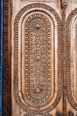 oriental arab pattern Uzbek traditional ornament on wooden carved door in Tashkent in Uzbekistan...