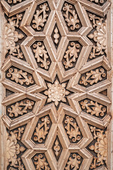 oriental Islamic pattern Uzbek traditional ornament on wooden carved door in Tashkent in Uzbekistan close-up