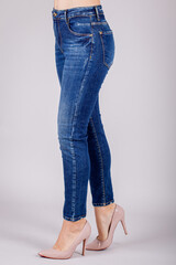 Close up of woman wearing blue jeans. Female in blue jeans.