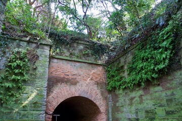 Brick and concrete wall tunnel in Sarushima Park