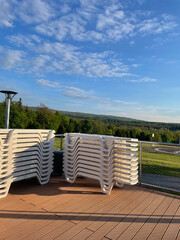 Sunbeds near outdoor swimming pool at luxury resort